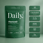 A dark green stand-up pouch labeled 'Daily Vitamored' dietary supplement stands against a matching green background, with six dark green callout boxes on the right listing key features: 10 mcg Vitamin D3, Calcifiediol form of D3, 3.2x more potent, 600 mcg per pouch, 60 tablets, and 5x better absorbed.